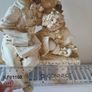 Boy and girl on bench Figurine Image 2
