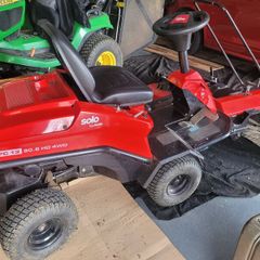 Lawnmower with mechanical brush