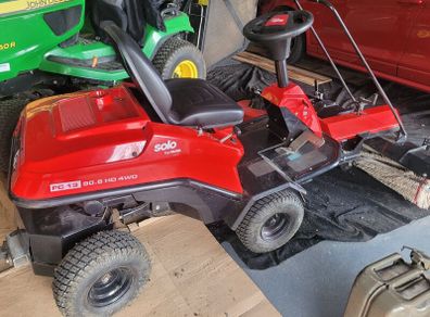 Lawnmower with mechanical brush