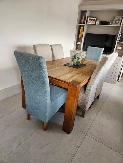 dining table and chairs oak table very good quality and solid chairs are as new  o marks or stains