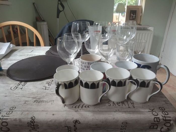 assorted drinking glasses, cups mugs.
