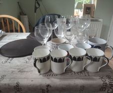 assorted drinking glasses, cups mugs.