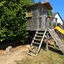 treehouse with swings slide climbing wall and gym bar Image 2