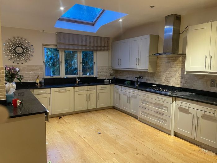 Entire kitchen Quartz work top solid wooden shaker style doors
