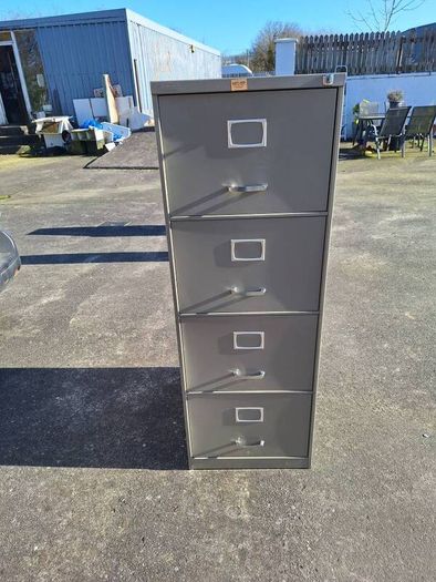 Four drawer metal filing cabinet with key