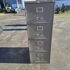 Four drawer metal filing cabinet with key
