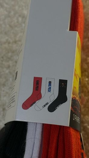 Set of 3 pairs of licensed One Piece socks featuring Straw Hat Pirates graphics.