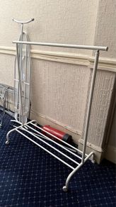 Clothes hanging rack with bench