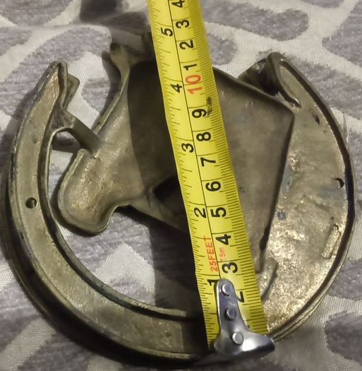 two brass horse shoe door knockers