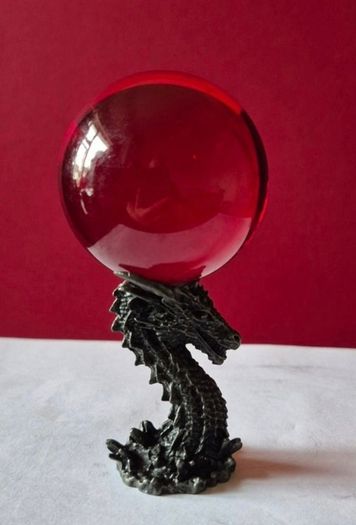 Red crystal/glass ball and metal dragon stand.