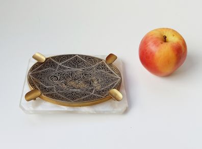 Nice highly engraved ashtray on faux mother of pearl base