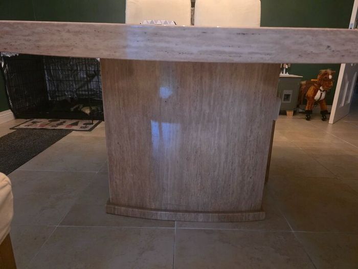 Marble table with 4 cream leather chairs
