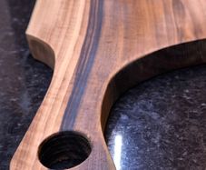 One piece of solid European Walnut, no glue, no joints. Hand-sanded and oiled with food-safe oil.