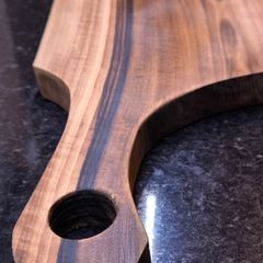 One piece of solid European Walnut, no glue, no joints. Hand-sanded and oiled with food-safe oil.