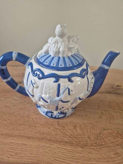 Blue and white ceramic teapot with quartz clock