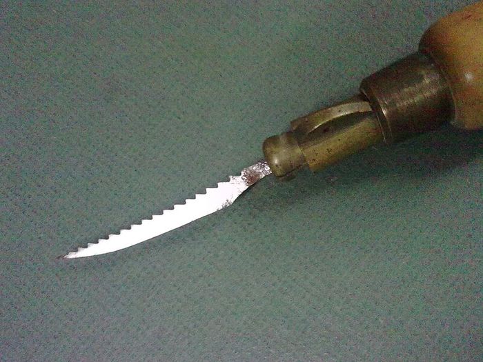 Old boxwood and brass tool pad with tools