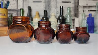 370 - Set of 4 Vintage Collectible Decorative Dark Amber Glass Marmite Jars