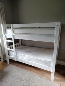 Bunk bed with mattresses, duvets and bedding sets
