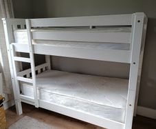 Bunk bed with mattresses, duvets and bedding sets