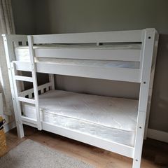 Bunk bed with mattresses, duvets and bedding sets