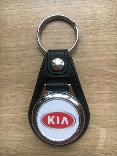 Brand new synthetic leather Kia key ring with shopping trolley token/coin