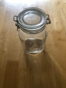 Airtight glass storage jar with clasp