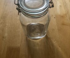 Airtight glass storage jar with clasp