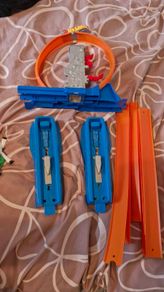 Hotwheels cars and track with loop. Plus bikes and playmat