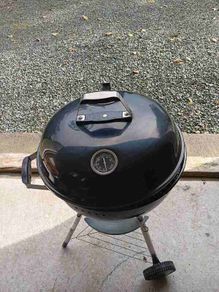 Charcoal kettle barbecue with lid thermometer and cover