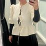 cream jacket and black skirt Image 2