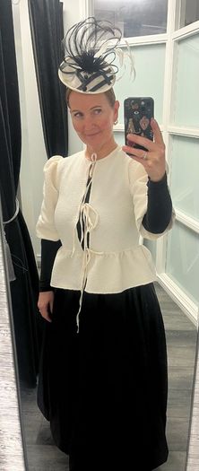 cream jacket and black skirt