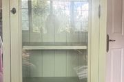 Sage green glass cabinet- right sided door opening