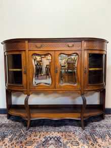 Early 20th Century Bow Front Walnut Display Cabinet with Beveled Glass Doors