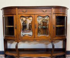 Early 20th Century Bow Front Walnut Display Cabinet with Beveled Glass Doors