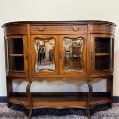 Early 20th Century Bow Front Walnut Display Cabinet with Beveled Glass Doors