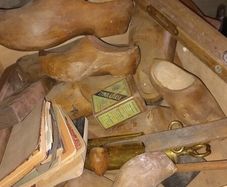 Antique wooden clogs and clog making tools