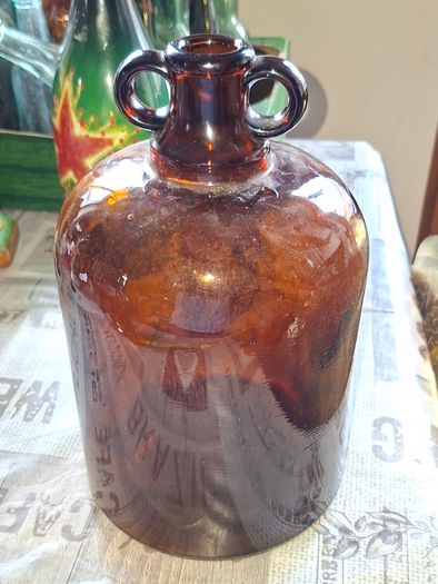 2 Demijohn Jars, Amber and Clear glass,  Stage or Movie Props collectible. Postage Available or Collection