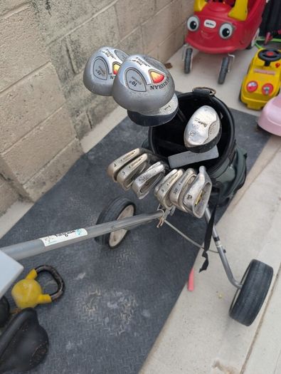 Cheap set of golf clubs and trolley