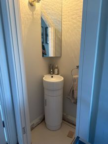 Corner vanity unit with sink