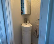 Corner vanity unit with sink