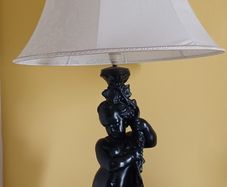 Lamp with figure of boy