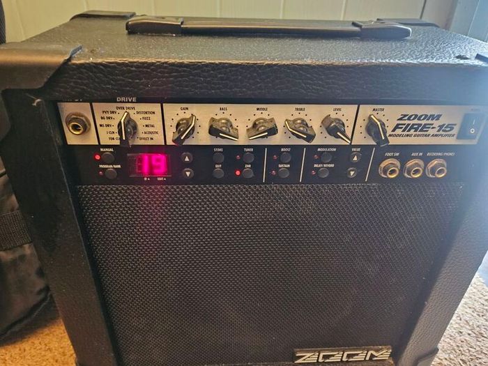 Aria electric guitar with Zoom Fire-15 Amp