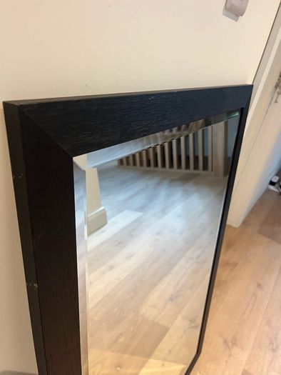 Black framed bevelled mirror