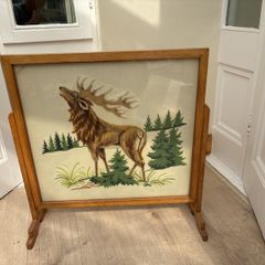 Antique needlepoint fireguard.