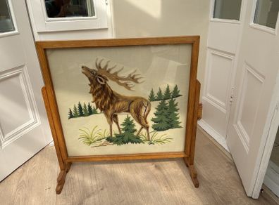 Antique needlepoint fireguard.