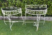 A vintage retro kitsch set of demilune wrought iron tables with glass toos c1950