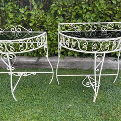 A vintage retro kitsch set of demilune wrought iron tables with glass toos c1950