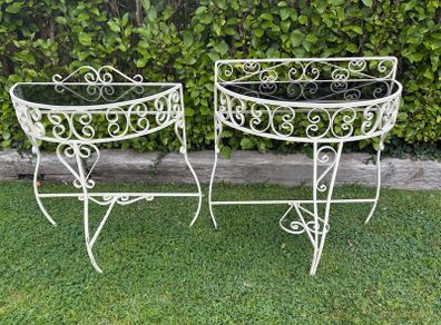 A vintage retro kitsch set of demilune wrought iron tables with glass toos c1950