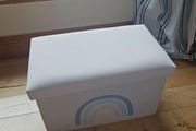 Storage box with a rainbow design