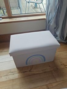 Storage box with a rainbow design
